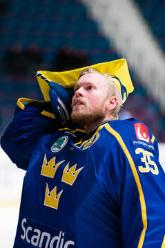 goaltender Magnus Hellberg of Sweden looks dejected