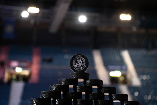 Pucks intended for the warm up are carefully placed in a