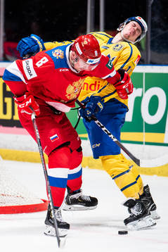 Rushan Rafikov of Russia tackles Joakim Nygård of Sweden