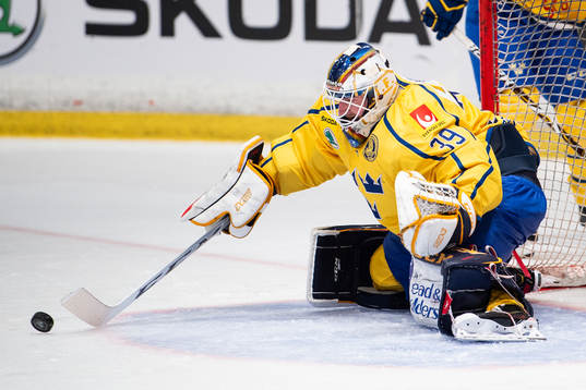 goaltender Adam Reideborn of Sweden with a save