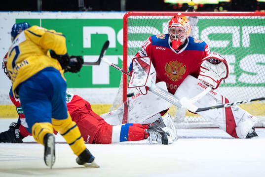 Joel Kellman of Sweden with a shot against goaltender Igor