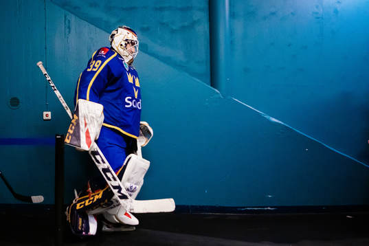 Goaltender Adam Reideborn of Sweden a head of the Beijer