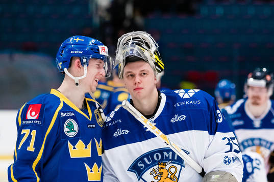Jonathan Davidsson of Sweden and  goaltender Veini