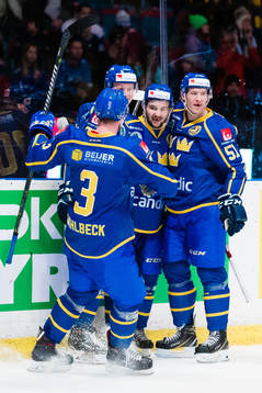 Emil Bemström of Sweden celebrates with teammates