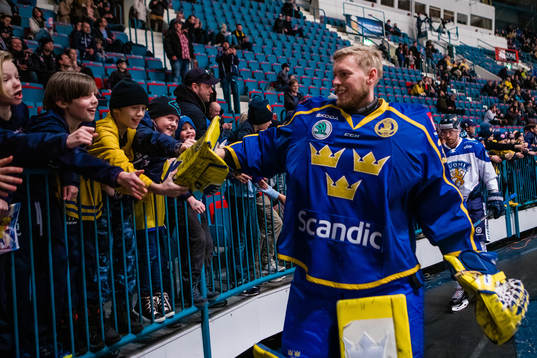 Goaltender Magnus Hellberg of Sweden and young supporters a