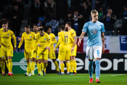 Sören Rieks of Malmö FF looks dejected while players of
