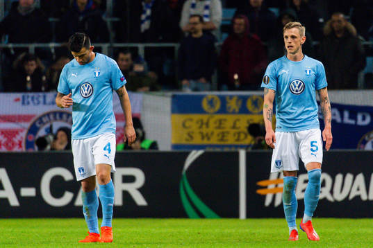 Behrang Safari and Sören Rieks of Malmö FF looks dejected