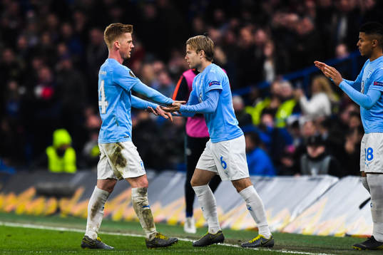 Anders Christiansen changes with Oscar Lewicki of Malmö FF