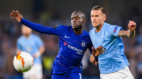 N'Golo Kante of Chelsea in action with Arnor Traustason of