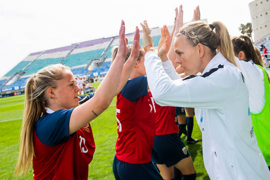 Therese Sessy Åsland and goalkeeper Ingrid Hjelmseth of