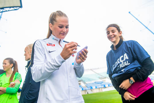 Lisa-Marie Karlseng Utland of Norway writes autographs