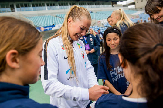 Lisa-Marie Karlseng Utland of Norway writes autographs