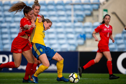 Mimmi Larsson of Sweden fights for the ball with Luana
