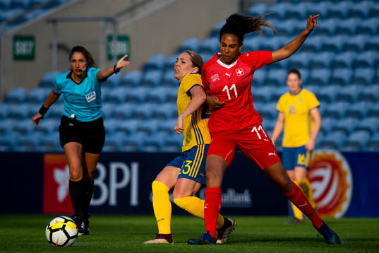 Elin Rubensson of Sweden fights for the ball with Louisa