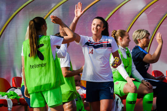 Ingrid Syrstad Engen of Norway celebrates with substitutes
