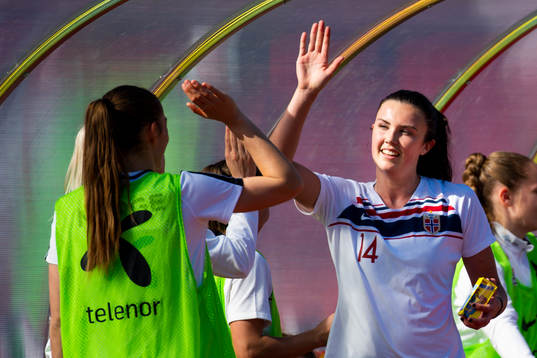Ingrid Syrstad Engen of Norway celebrates with her teammates