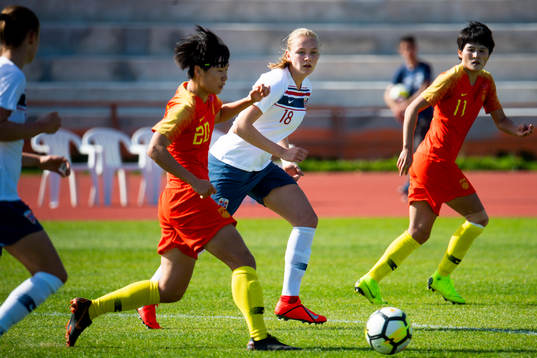 Frida Maanum of Norway watches Zhang Rui of China