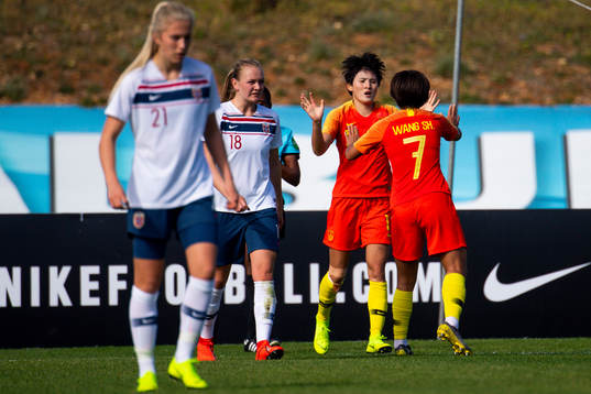 Wang Shanshan of China celebrates with her teammates