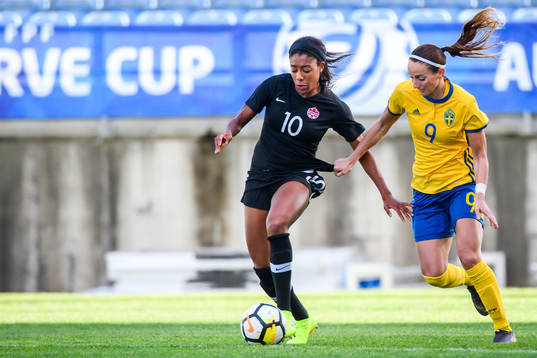 Ashley Lawrence of Canada and Kosovare Asllani of Sweden