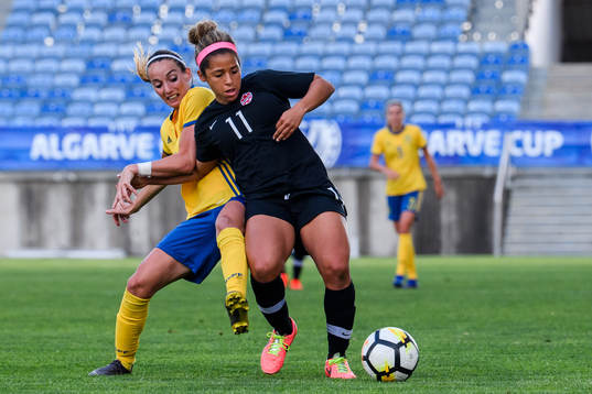 Kosovare Asllani of Sweden and Desiree Scott of Canada