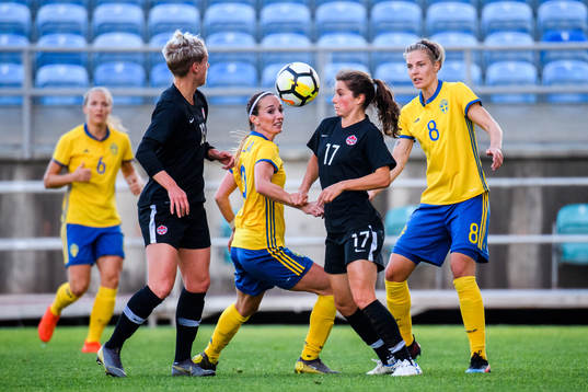 Kosovare Asllani of Sweden and Jessie Fleming of Canada