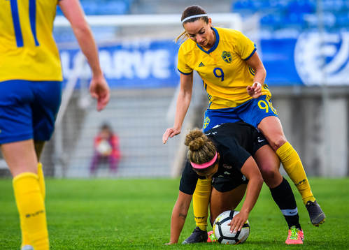 Kosovare Asllani of Sweden and Desiree Scott of Canada