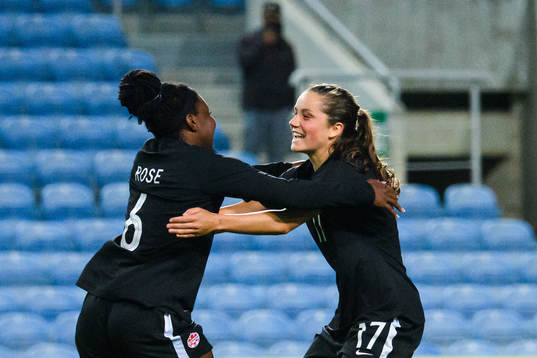 Deanne Rose and Jessie Fleming of Canada celebrates