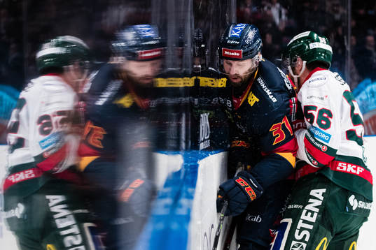 Djurgårdens Dick Axelsson  och Frölundas Jonathan Sigalet