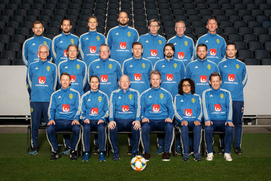 Staff of the Swedish national football team pose for a