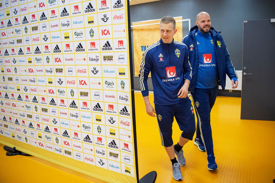Karl-Johan Johnsson of Sweden and media officer Jakob
