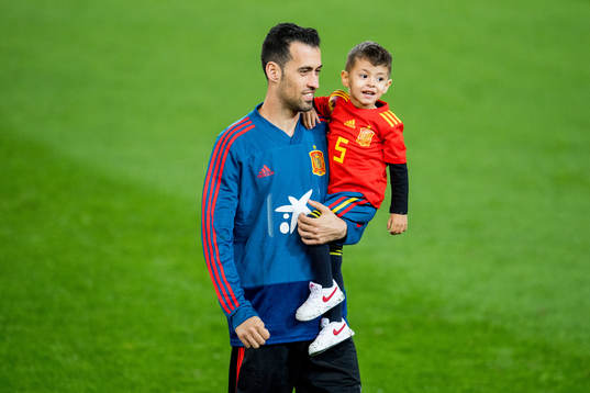 Sergio Busquets of Spain with his son