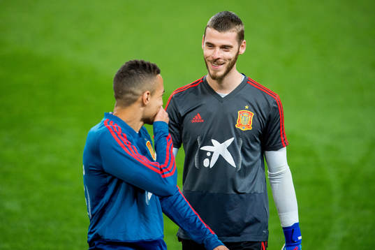 Rodrigo Moreno Machado and goalkeeper David de Gea of Spain