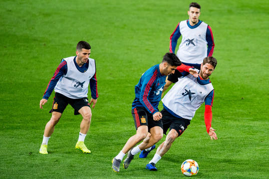 Marco Asensio and Sergio Ramos of Spain