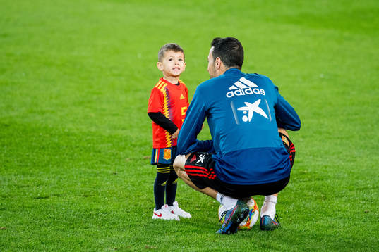Sergio Busquets of Spain with his son
