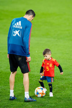 Sergio Busquets of Spain with his son