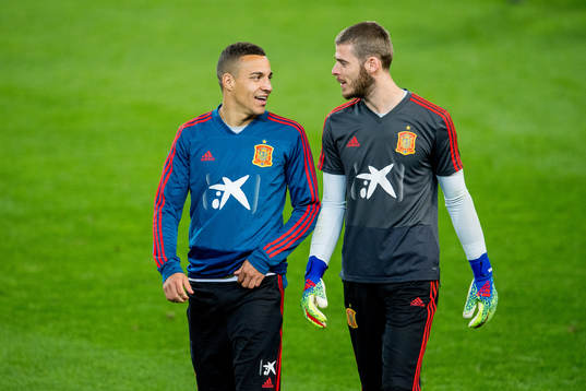 Rodrigo Moreno Machado and goalkeeper David de Gea of Spain