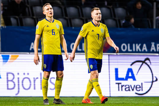 Ludwig Augustinsson and Sebastian Larsson of Sweden look