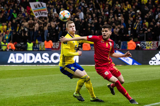 Emil Krafth of Sweden and Ianis Hagi of Romania competes
