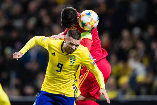 Marcus Berg of Sweden and Cristian Sapunaru of Romania