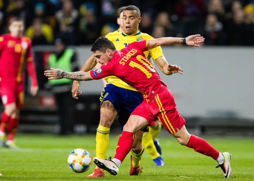 Robin Quaison of Sweden and Nicolae Stanciu of Romania