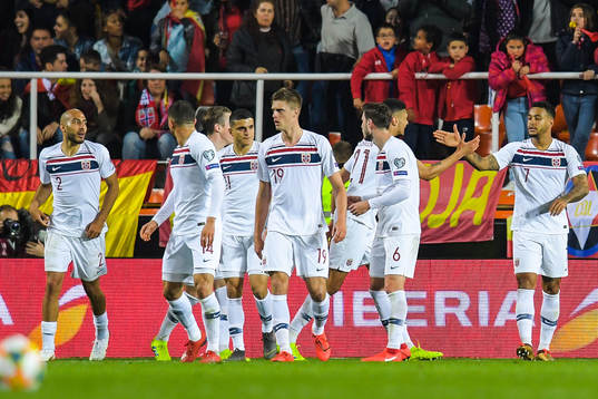 Joshua King of Norway celebrates with teammates
