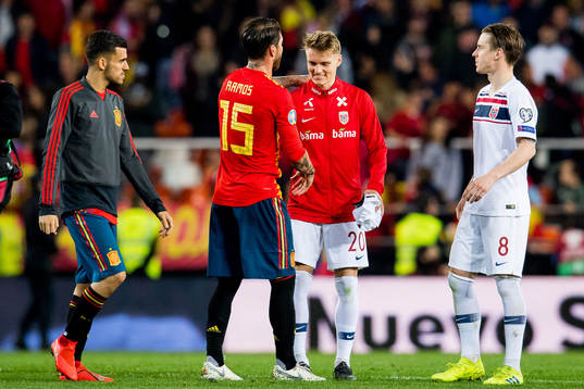 Sergio Ramos of Spain and Martin Ødegaard of Norway