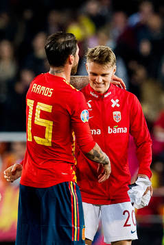 Sergio Ramos of Spain and Martin Ødegaard of Norway