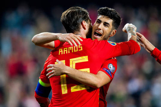 Sergio Ramos of Spain celebrates with teammate Marco Asensio