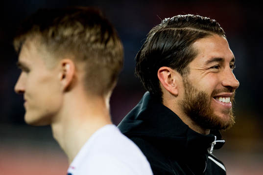 Martin Ødegaard of Norway and Sergio Ramos of Spain