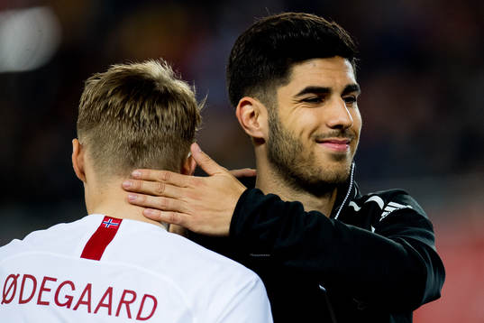Martin Ødegaard of Norway and Marco Asensio of Spain