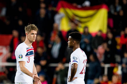 Kristoffer Ajer and Ola Kamara of Norway look dejected