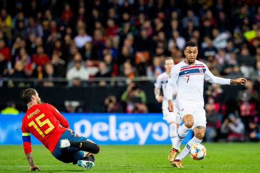 Sergio Ramos of Spain and Joshua King of Norway