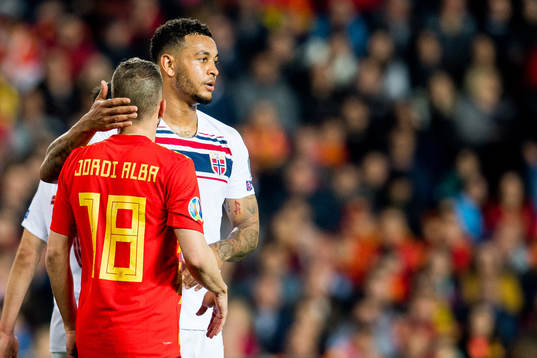 Jordi Alba of Spain and Joshua King of Norway