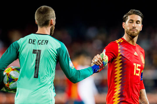 Goalkeeper David de Gea and Sergio Ramos of Spain